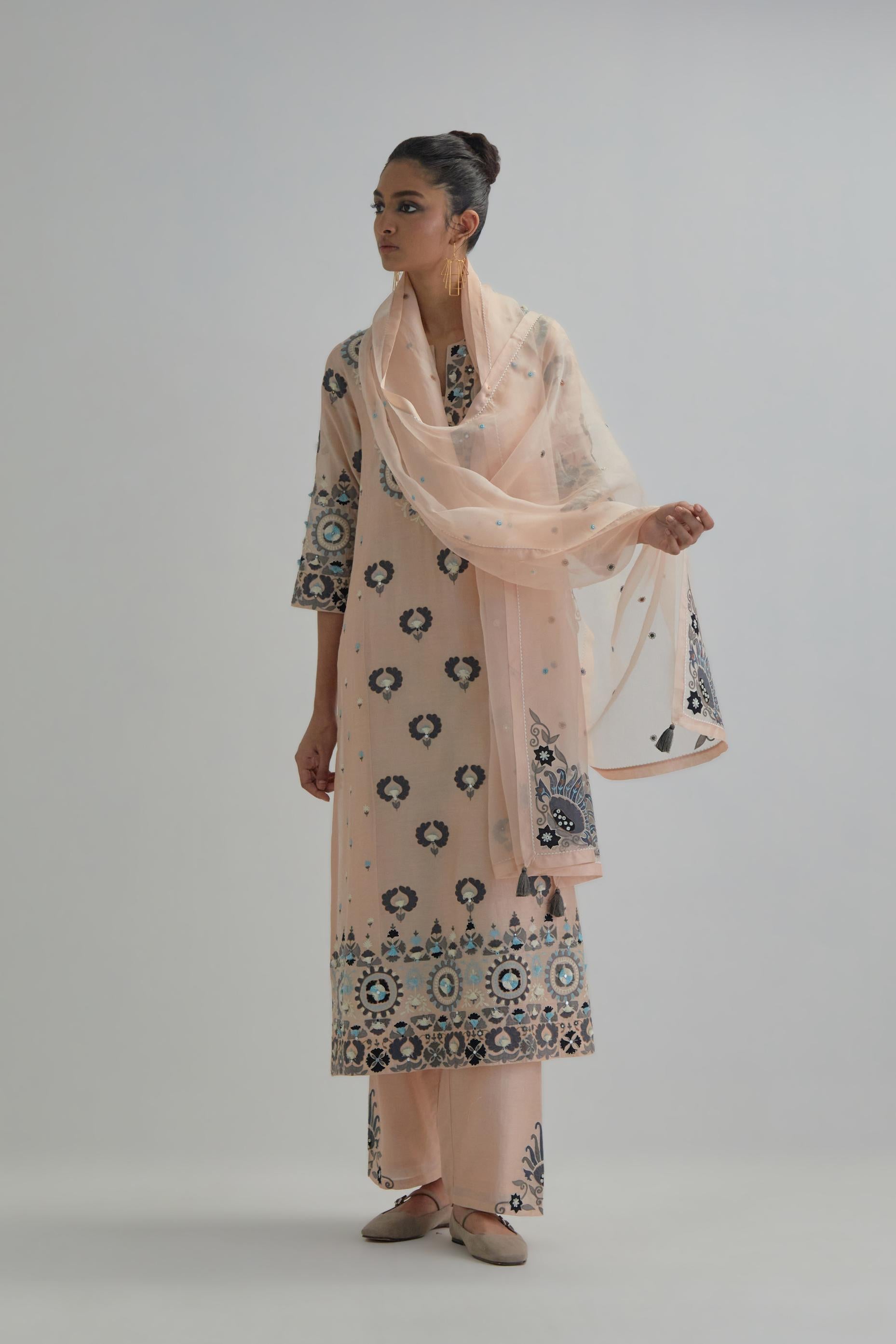 Pink straight kurta, fully embroidered with appliqué flowers, earthy-coloured Aari thread work and silk tassels.