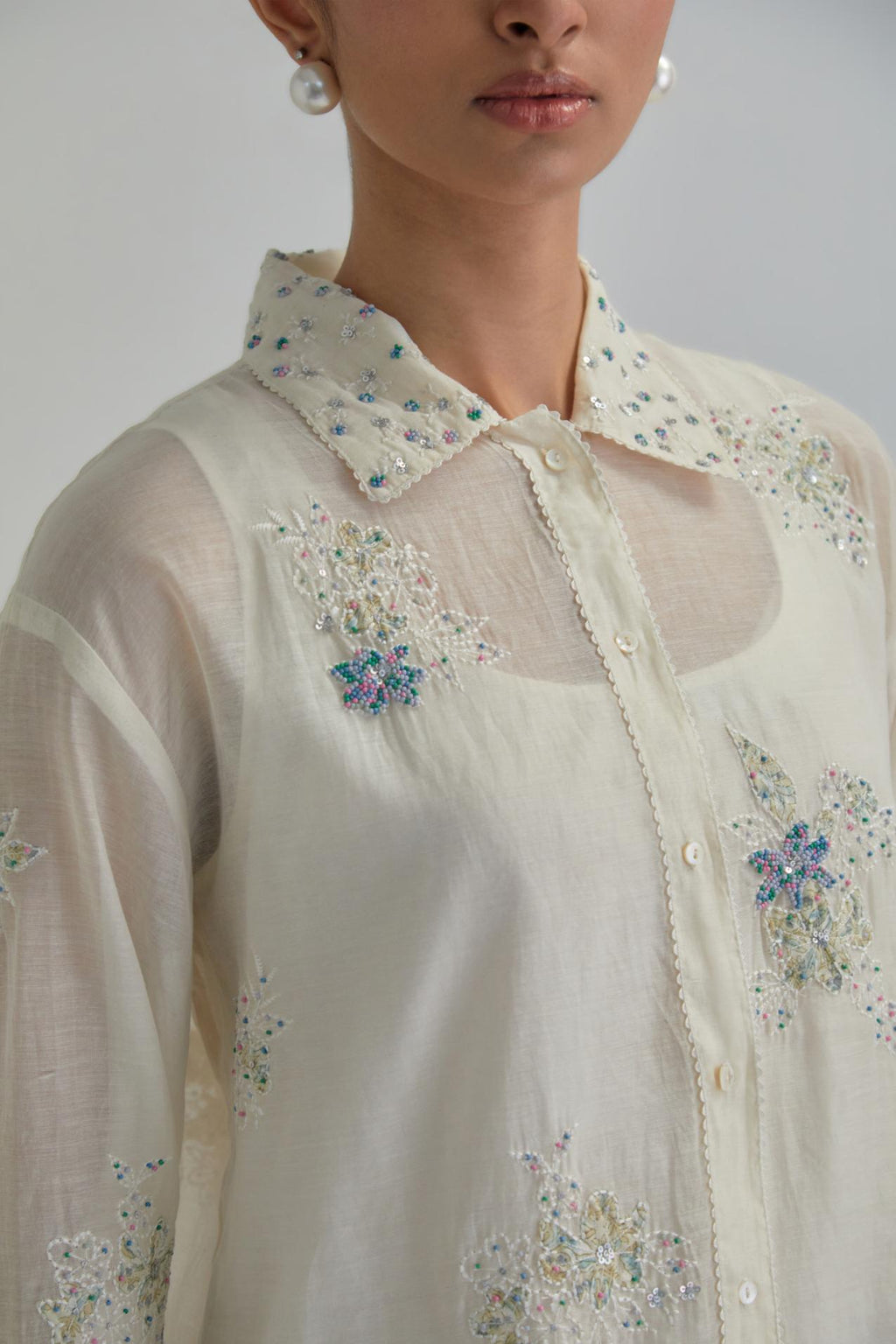 Off white cotton Chanderi embroidered shirt with full sleeves.
