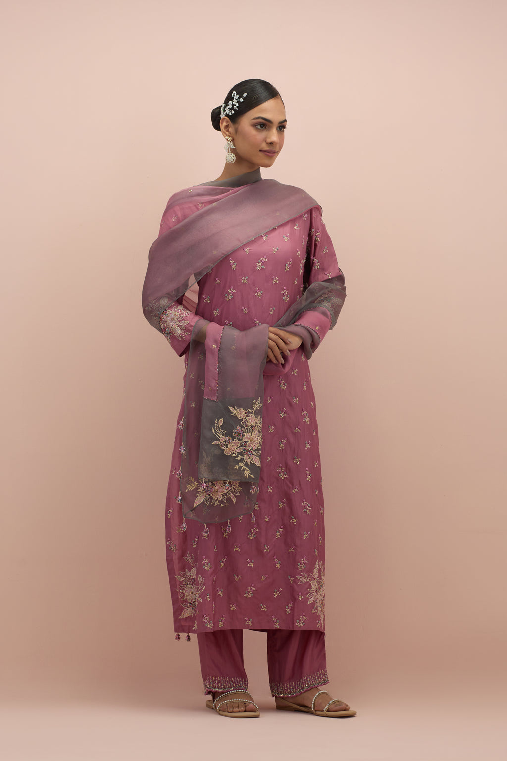 Salmon pink and iron grey silk organza narrow dupatta, highlighted with all-over delicate sequins flower and hand block printed appliqué motifs at dupatta corners.