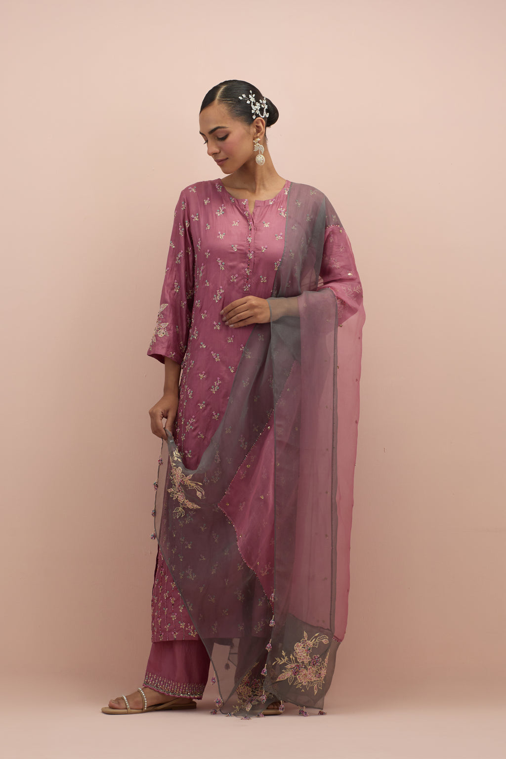 Salmon pink and iron grey silk organza narrow dupatta, highlighted with all-over delicate sequins flower and hand block printed appliqué motifs at dupatta corners.