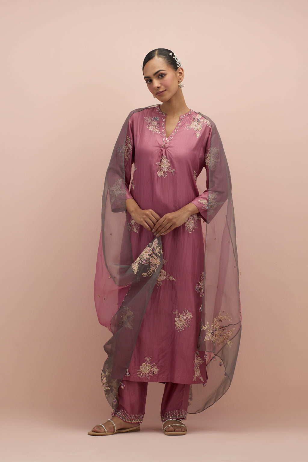 Salmon pink and iron grey silk organza narrow dupatta, highlighted with all-over delicate sequins flower and hand block printed appliqué motifs at dupatta corners.