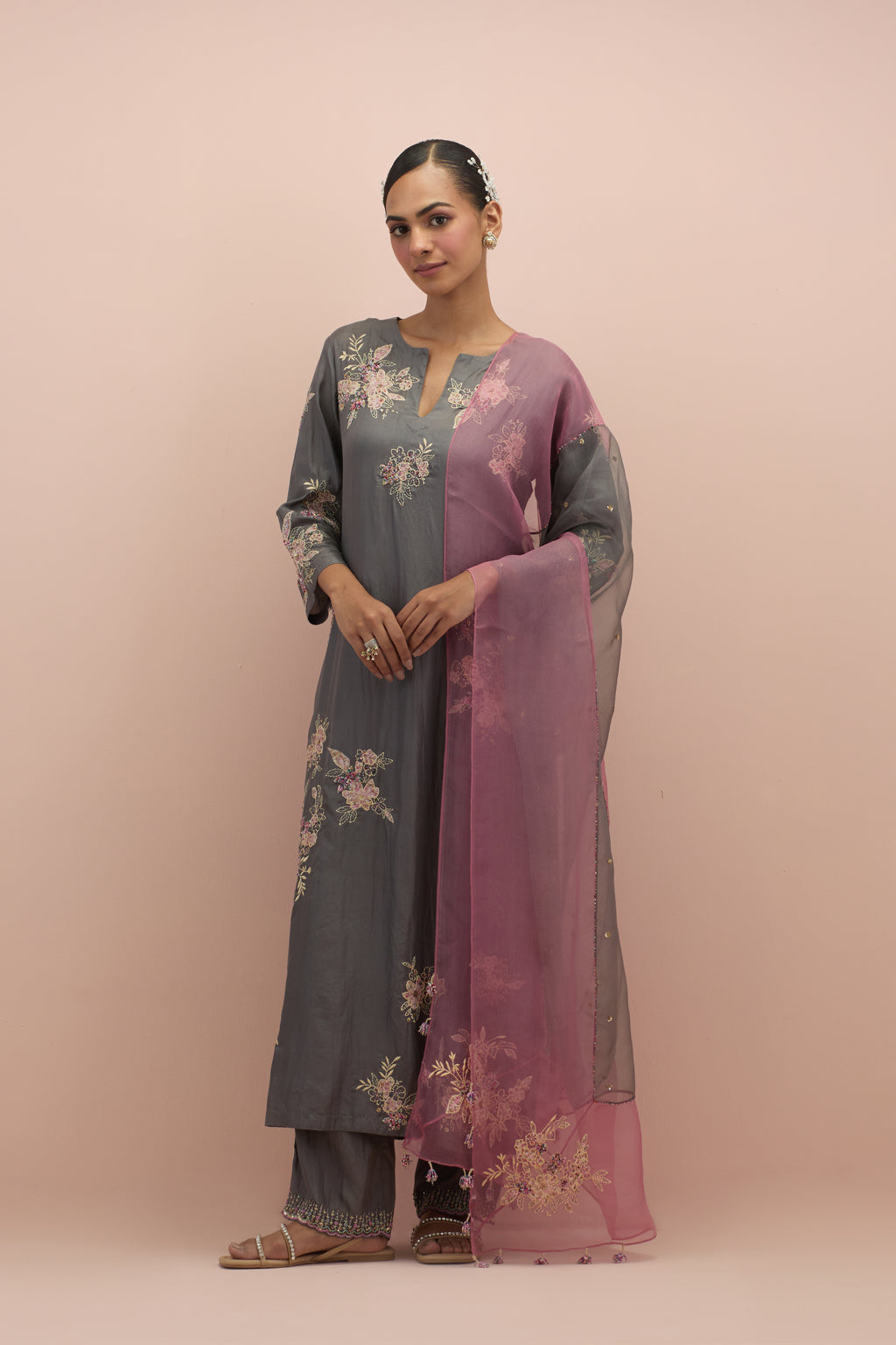 Iron grey & salmon pink silk organza narrow dupatta, highlighted with all-over delicate sequins flower and hand block printed appliqué motifs at dupatta corners.