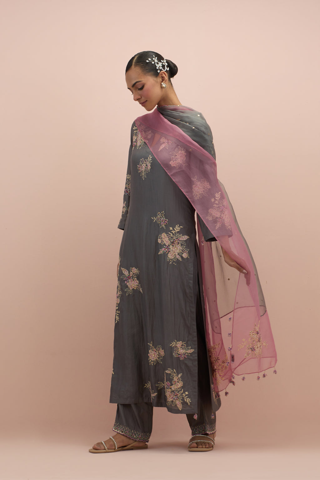 Iron grey & salmon pink silk organza narrow dupatta, highlighted with all-over delicate sequins flower and hand block printed appliqué motifs at dupatta corners.