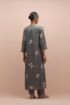 Iron grey straight kurta set with all-over delicate embroidered flowers, highlighted with sequins and multi-colored beads.