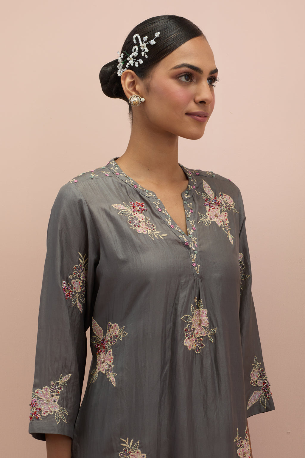 Iron grey straight kurta set with all-over delicate embroidered flowers, highlighted with sequins and multi-colored beads.