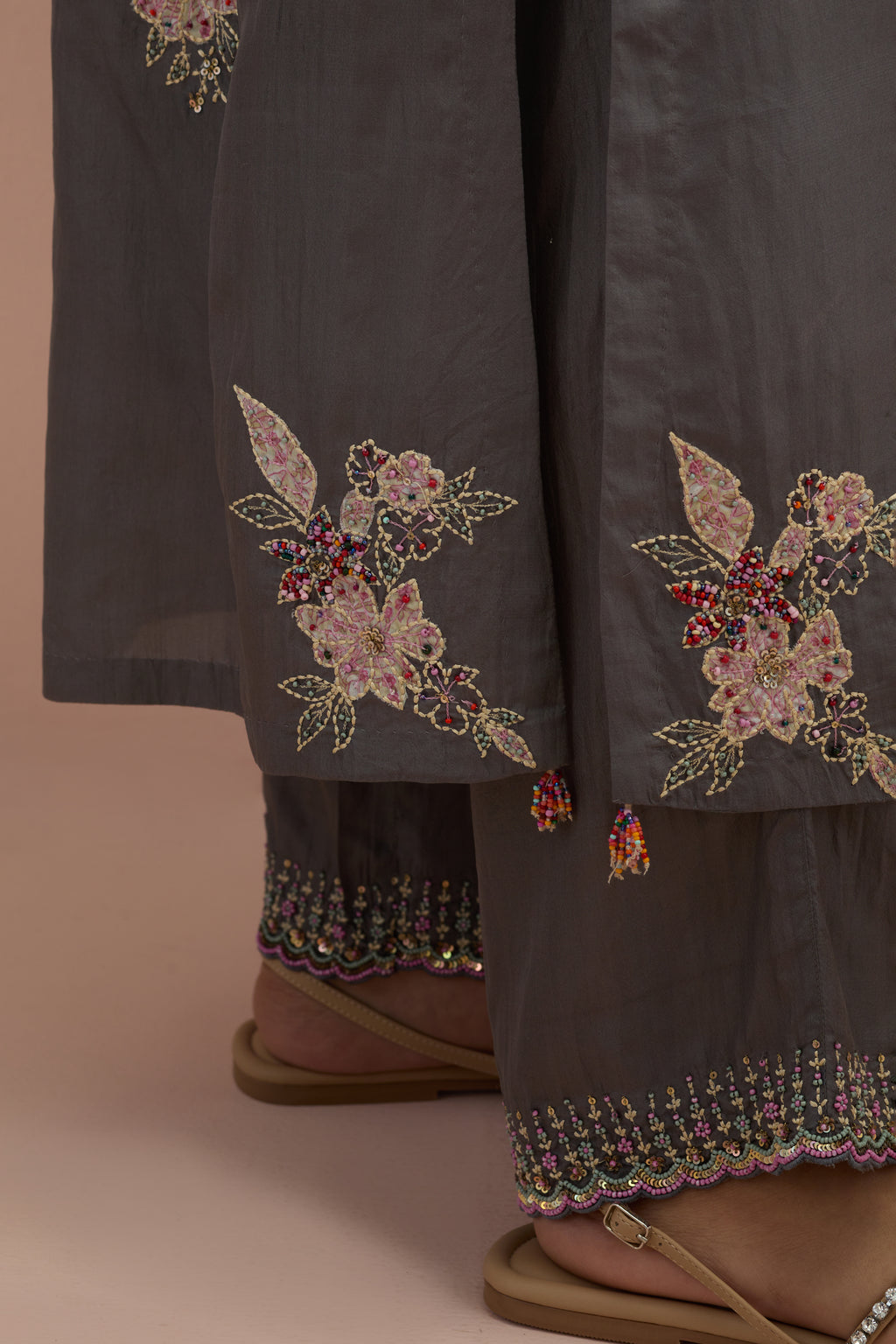 Iron grey straight kurta set with all-over delicate embroidered flowers, highlighted with sequins and multi-colored beads.