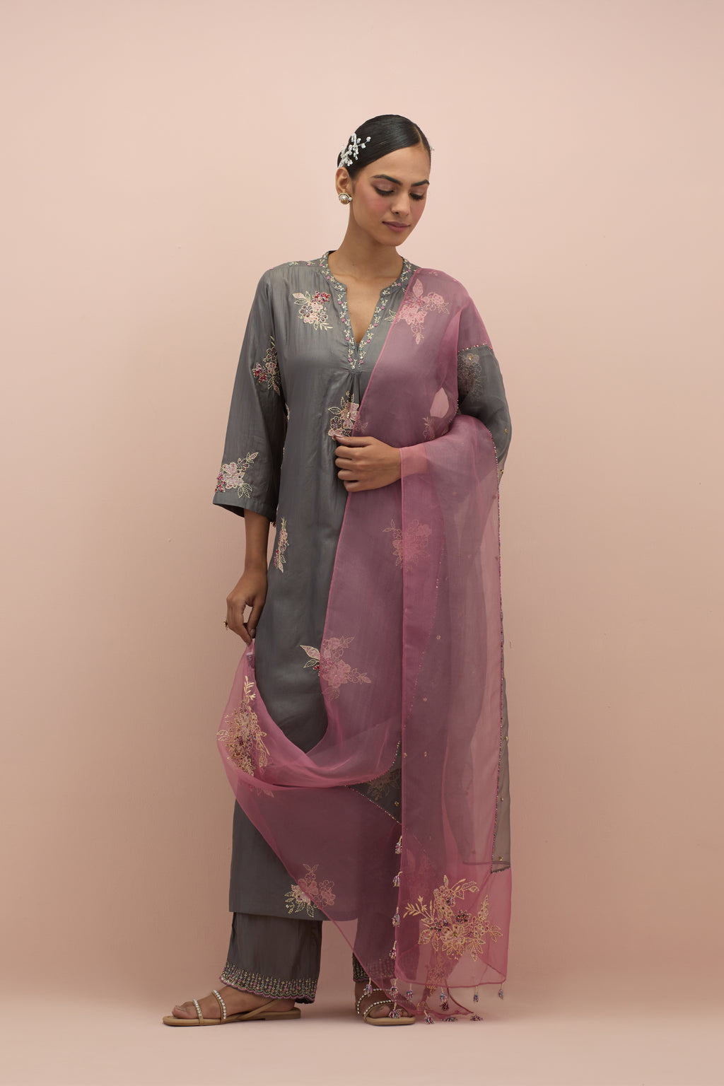 Iron grey & salmon pink silk organza narrow dupatta, highlighted with all-over delicate sequins flower and hand block printed appliqué motifs at dupatta corners.