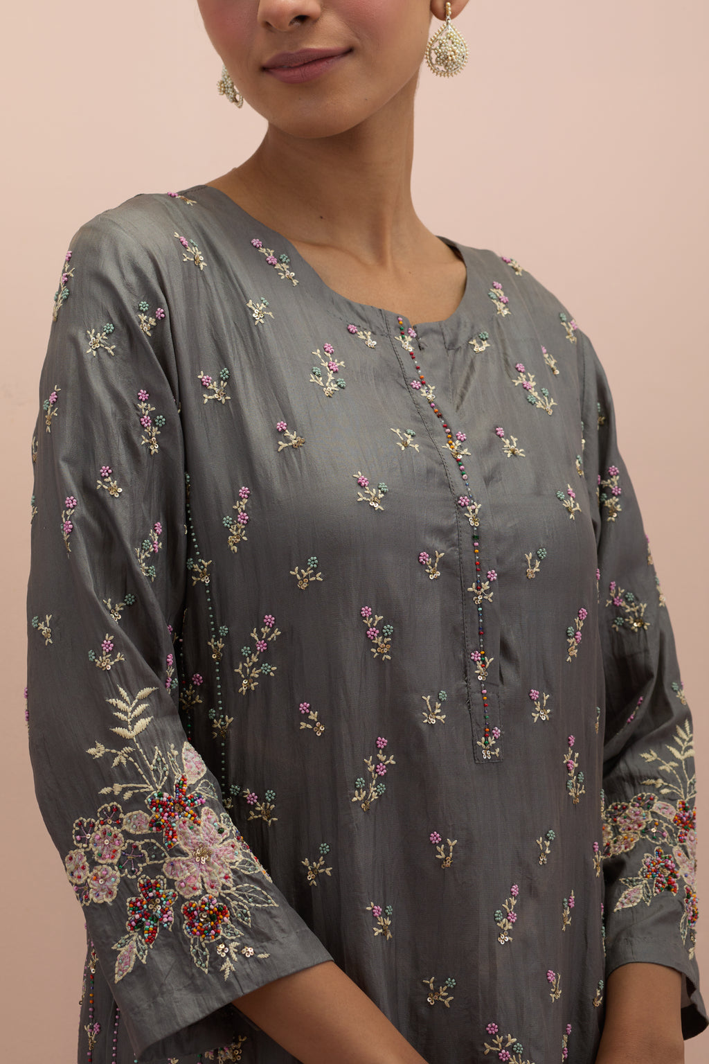 Iron grey straight kurta set with all-over delicate embroidered flowers, highlighted with sequins and multi-colored beads.