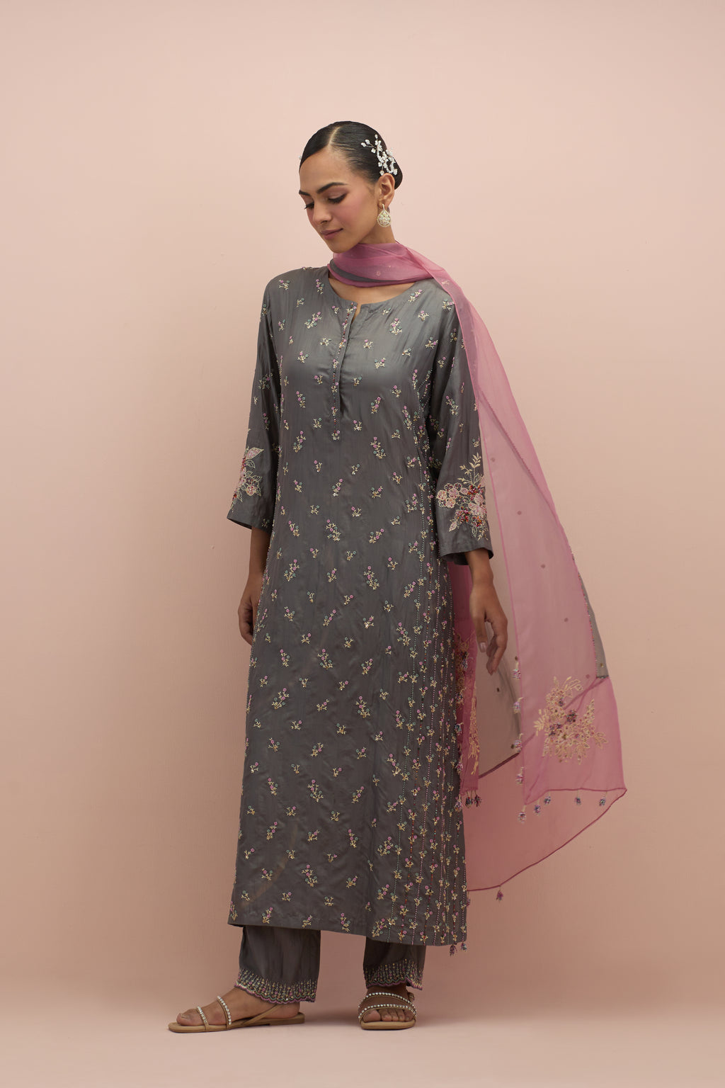 Iron grey straight kurta set with all-over delicate embroidered flowers, highlighted with sequins and multi-colored beads.