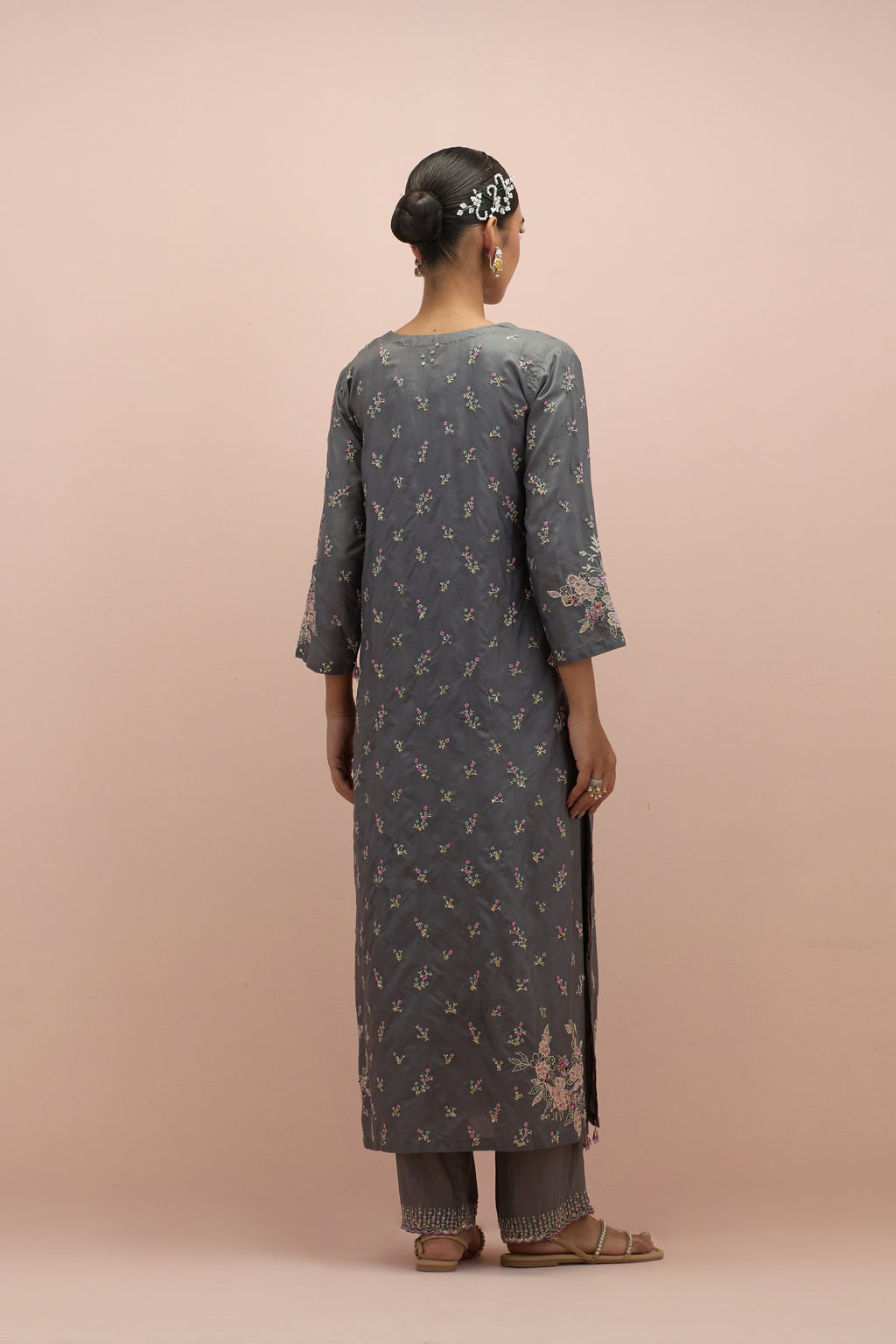 Iron grey silk straight kurta set with all-over delicate embroidered flowers, highlighted with sequins and multi-colored beads.