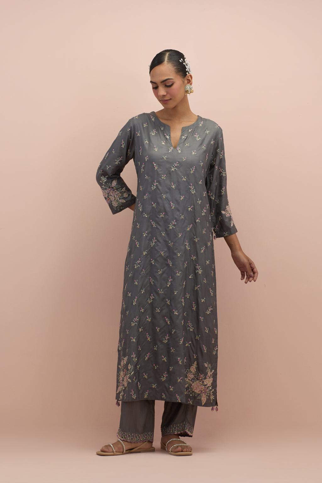 Iron grey silk straight kurta set with all-over delicate embroidered flowers, highlighted with sequins and multi-colored beads.