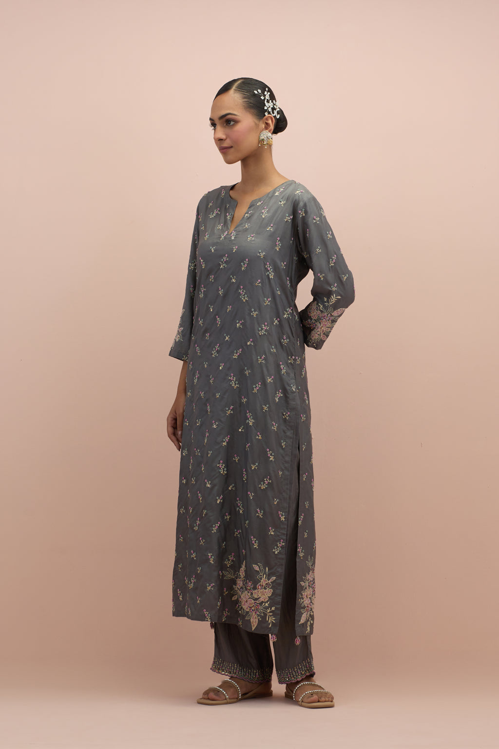 Iron grey silk straight kurta set with all-over delicate embroidered flowers, highlighted with sequins and multi-colored beads.