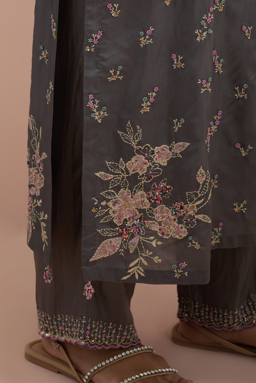 Iron grey silk straight kurta set with all-over delicate embroidered flowers, highlighted with sequins and multi-colored beads.