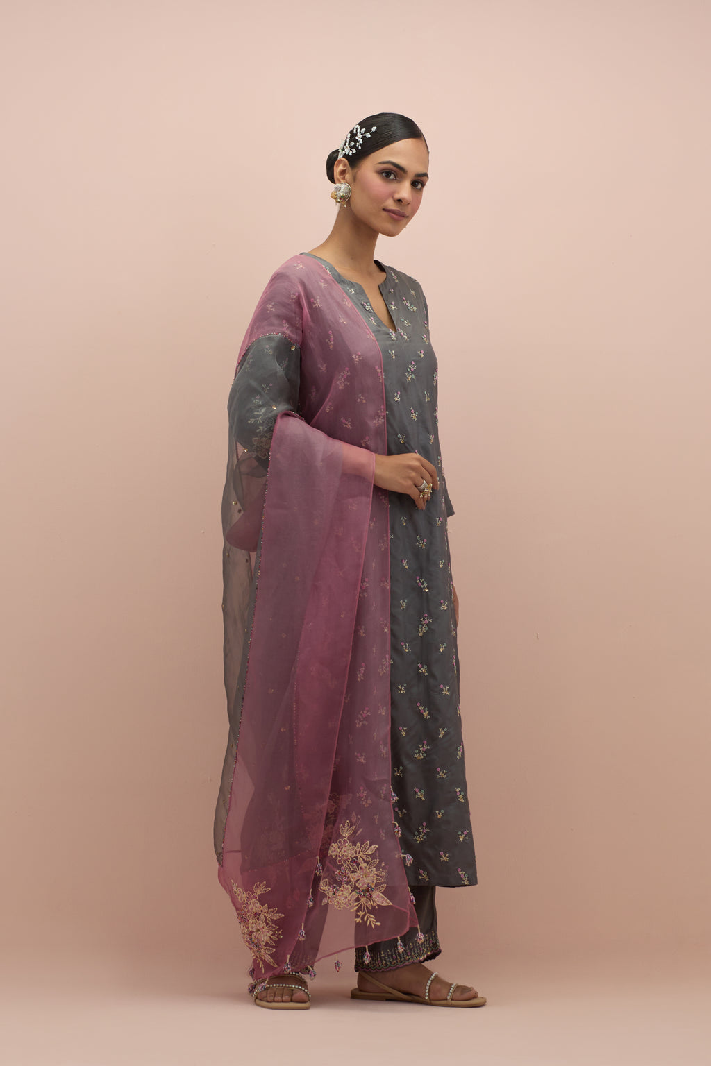 Iron grey silk straight kurta set with all-over delicate embroidered flowers, highlighted with sequins and multi-colored beads.