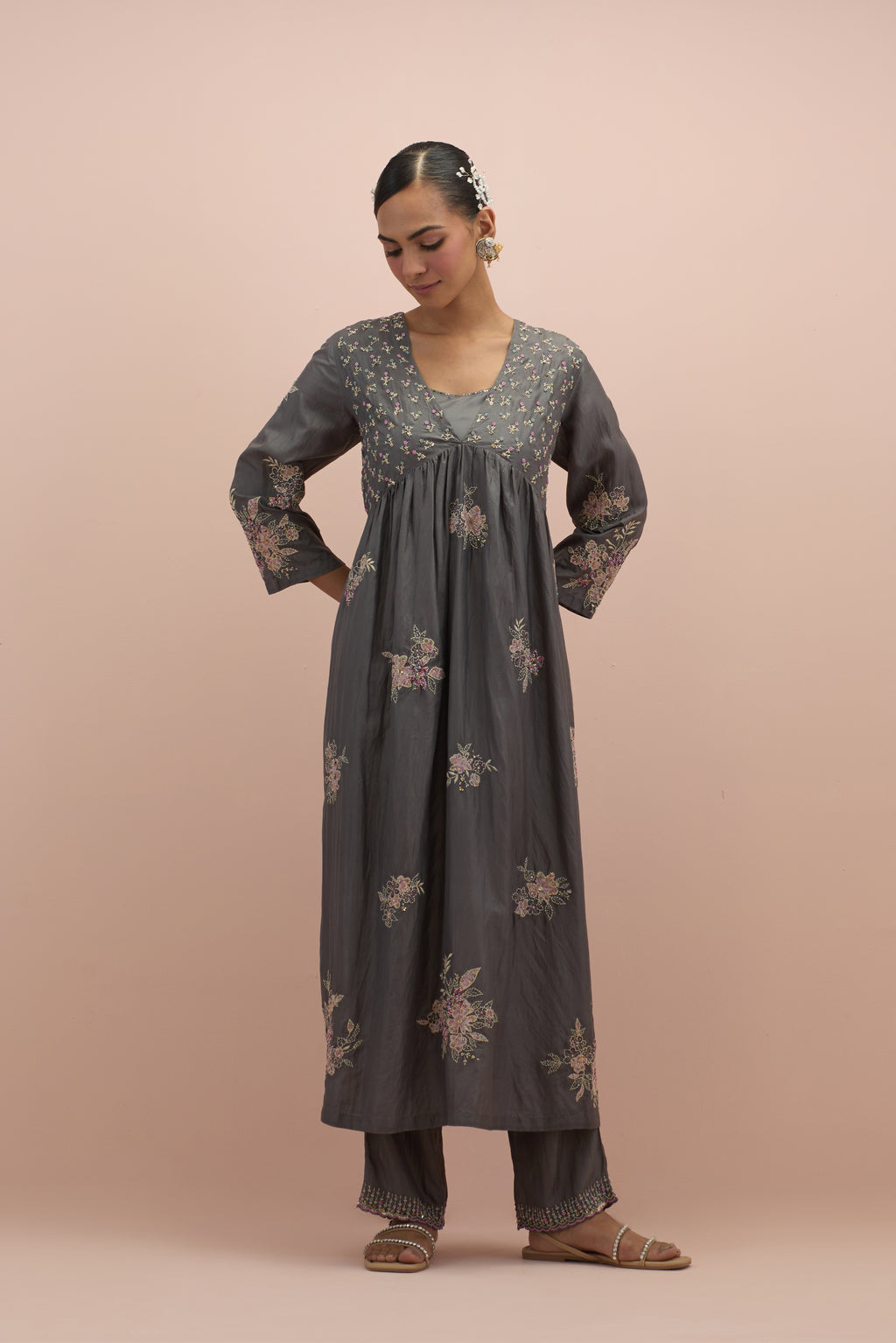 Iron grey silk kurta dress set with delicate embroidered flowers and hand block printed appliqué motifs, highlighted with sequins and multi-colored beads.