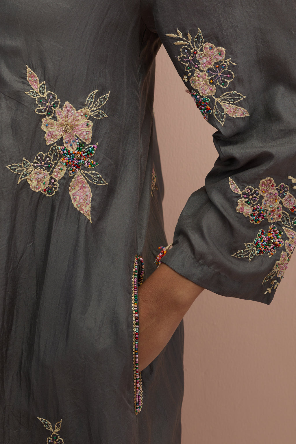 Iron grey silk short shirt-kurta set with all-over appliqué flowers, highlighted with sequins and multi-colored beads.