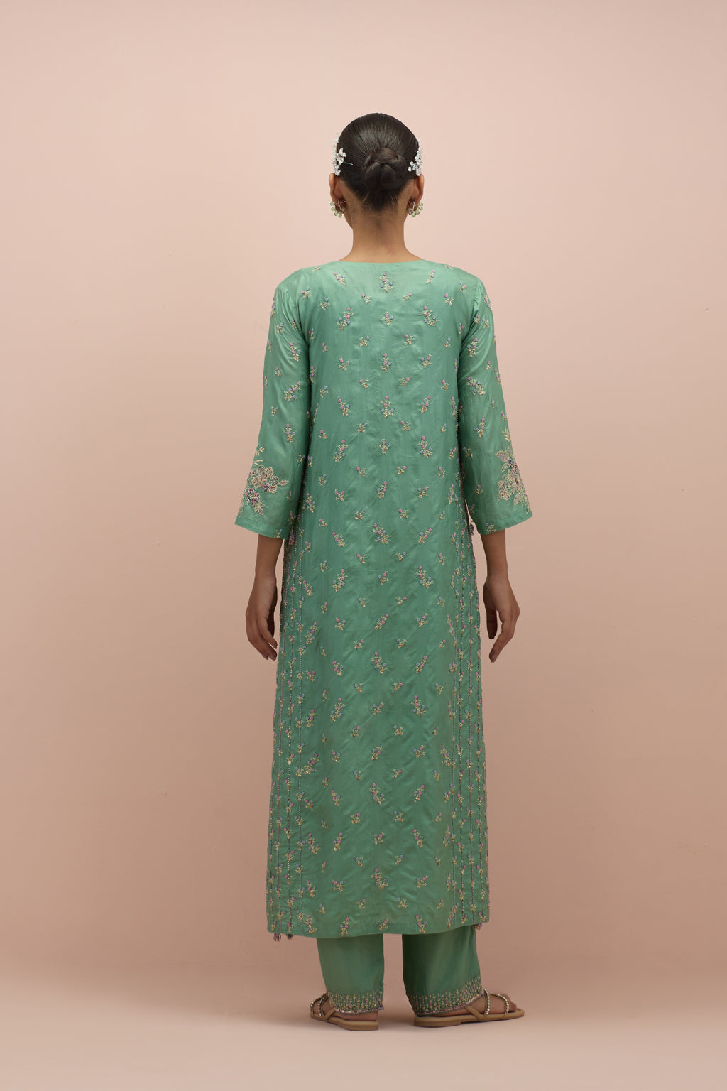 Jade green straight kurta set with all-over delicate embroidered flowers, highlighted with sequins and multi-colored beads.