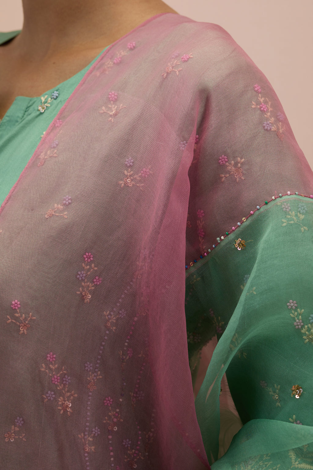 Jade green & salmon pink silk organza narrow dupatta, highlighted with all-over delicate sequins flower and hand block printed appliqué motifs at dupatta corners.