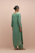 Jade green silk straight kurta set with all-over delicate embroidered flowers, highlighted with sequins and multi-colored beads.