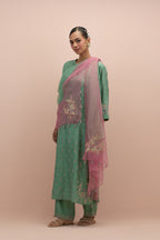Jade green silk straight kurta set with all-over delicate embroidered flowers, highlighted with sequins and multi-colored beads.