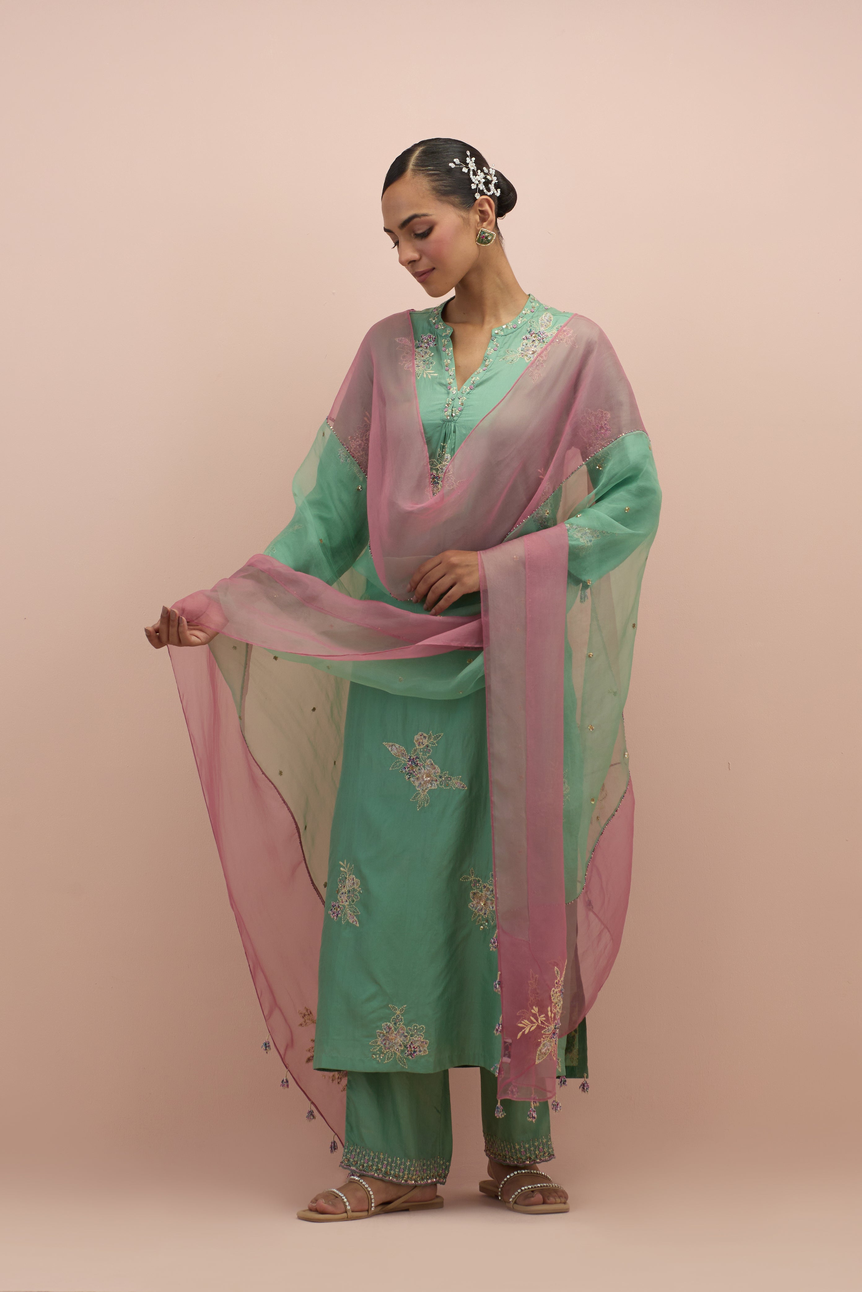 Jade green straight kurta set with all-over delicate embroidered flowers, highlighted with sequins and multi-colored beads.