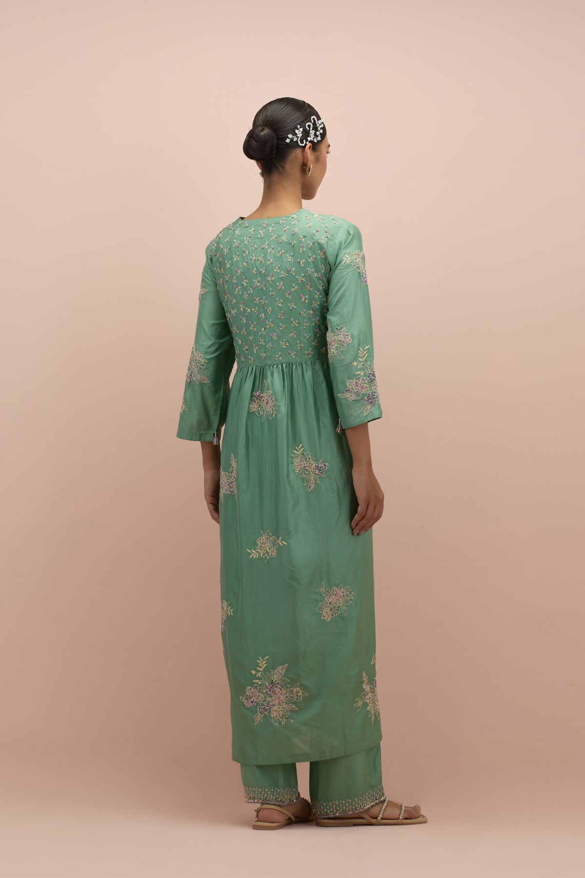 Jade green silk kurta dress set with delicate embroidered flowers and hand block printed appliqué motifs, highlighted with sequins and multi-colored beads.