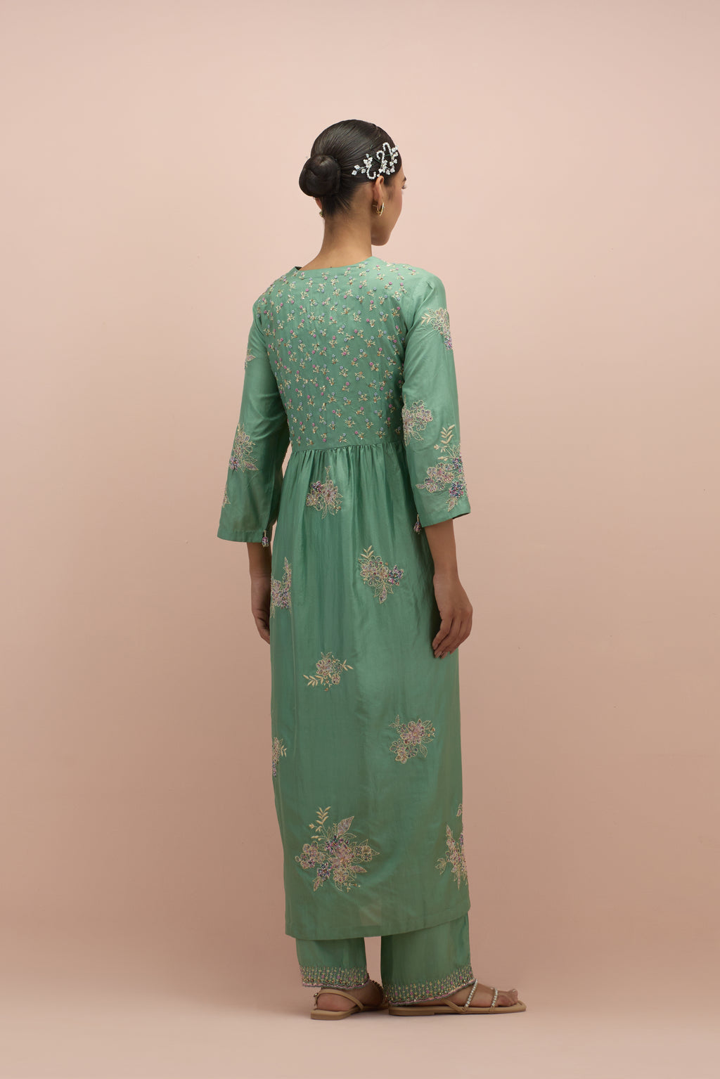 Jade green silk kurta dress set with delicate embroidered flowers and hand block printed appliqué motifs, highlighted with sequins and multi-colored beads.