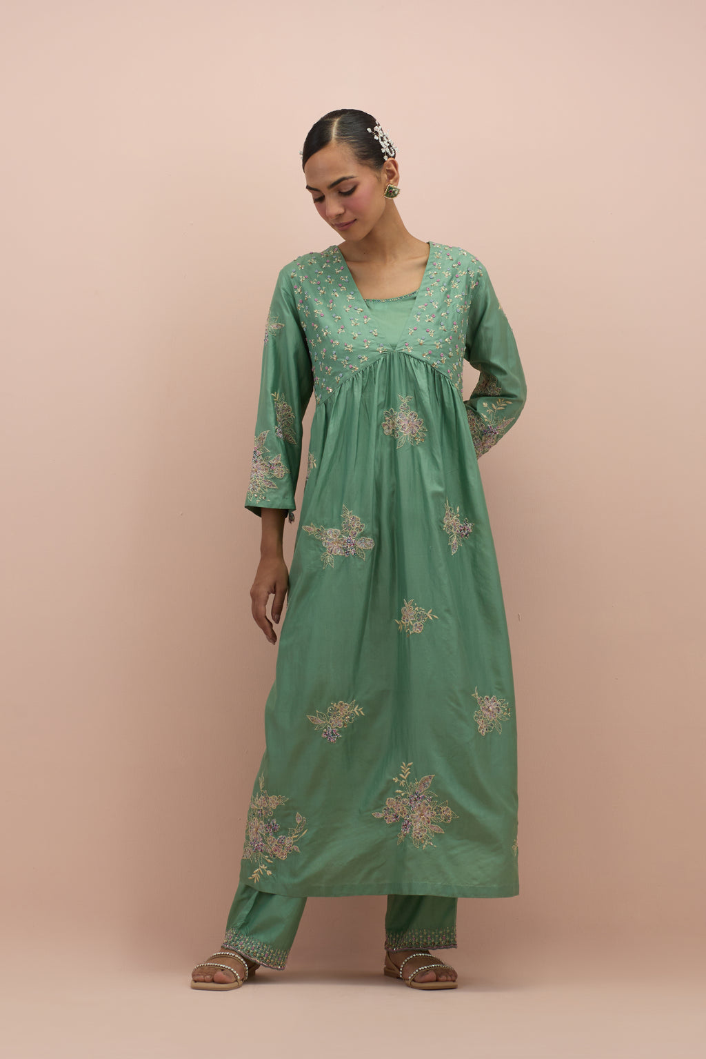 Jade green silk kurta dress set with delicate embroidered flowers and hand block printed appliqué motifs, highlighted with sequins and multi-colored beads.