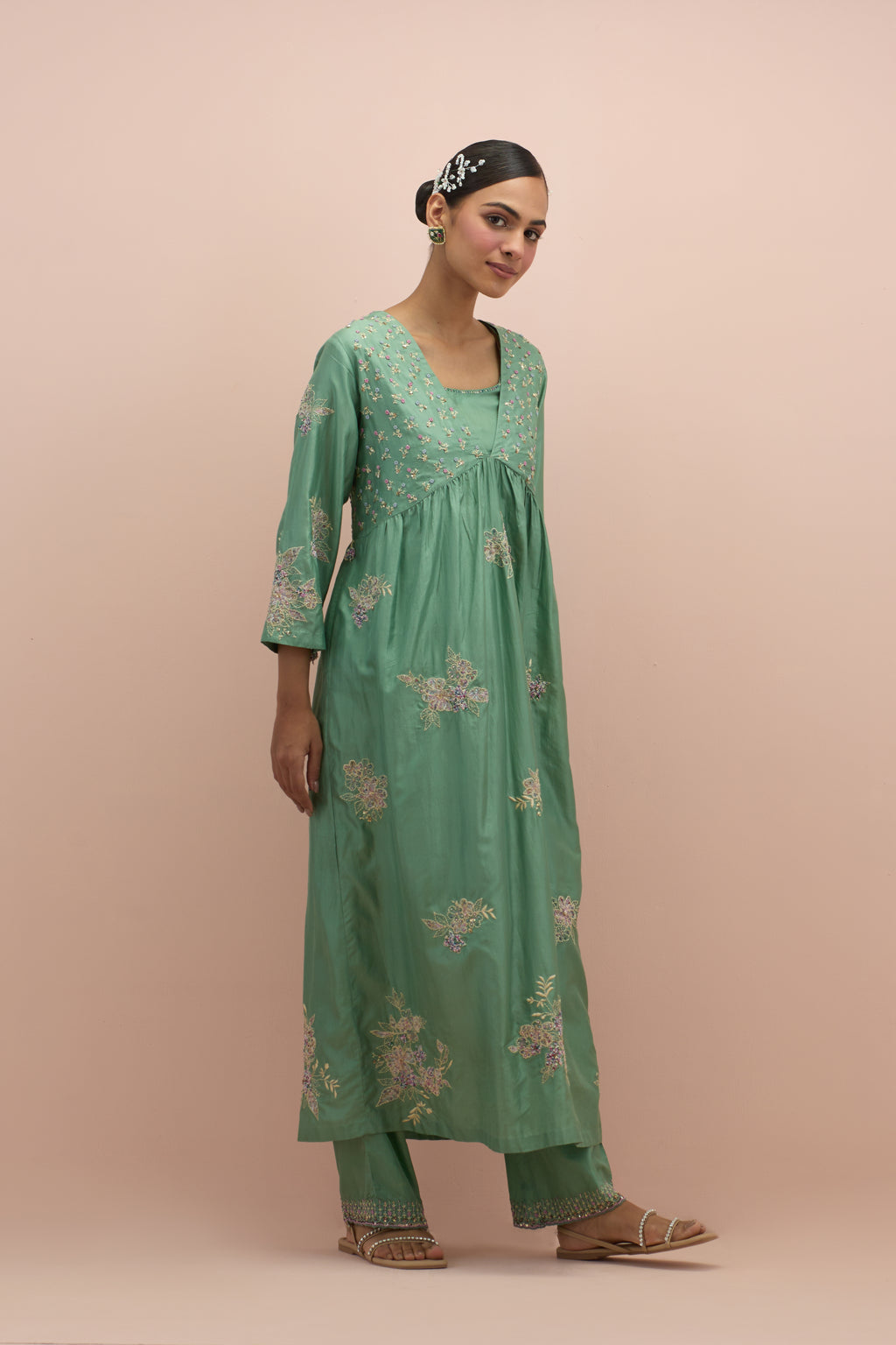 Jade green silk kurta dress set with delicate embroidered flowers and hand block printed appliqué motifs, highlighted with sequins and multi-colored beads.