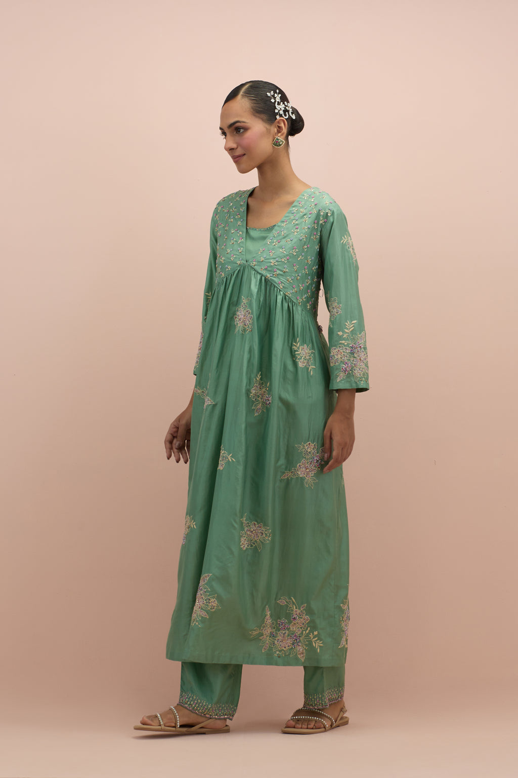 Jade green silk kurta dress set with delicate embroidered flowers and hand block printed appliqué motifs, highlighted with sequins and multi-colored beads.