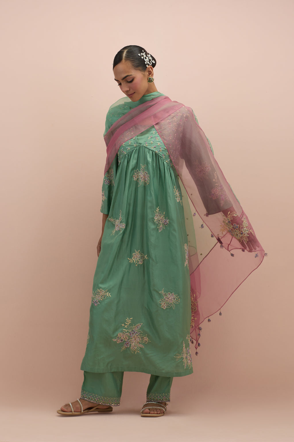 Jade green silk kurta dress set with delicate embroidered flowers and hand block printed appliqué motifs, highlighted with sequins and multi-colored beads.