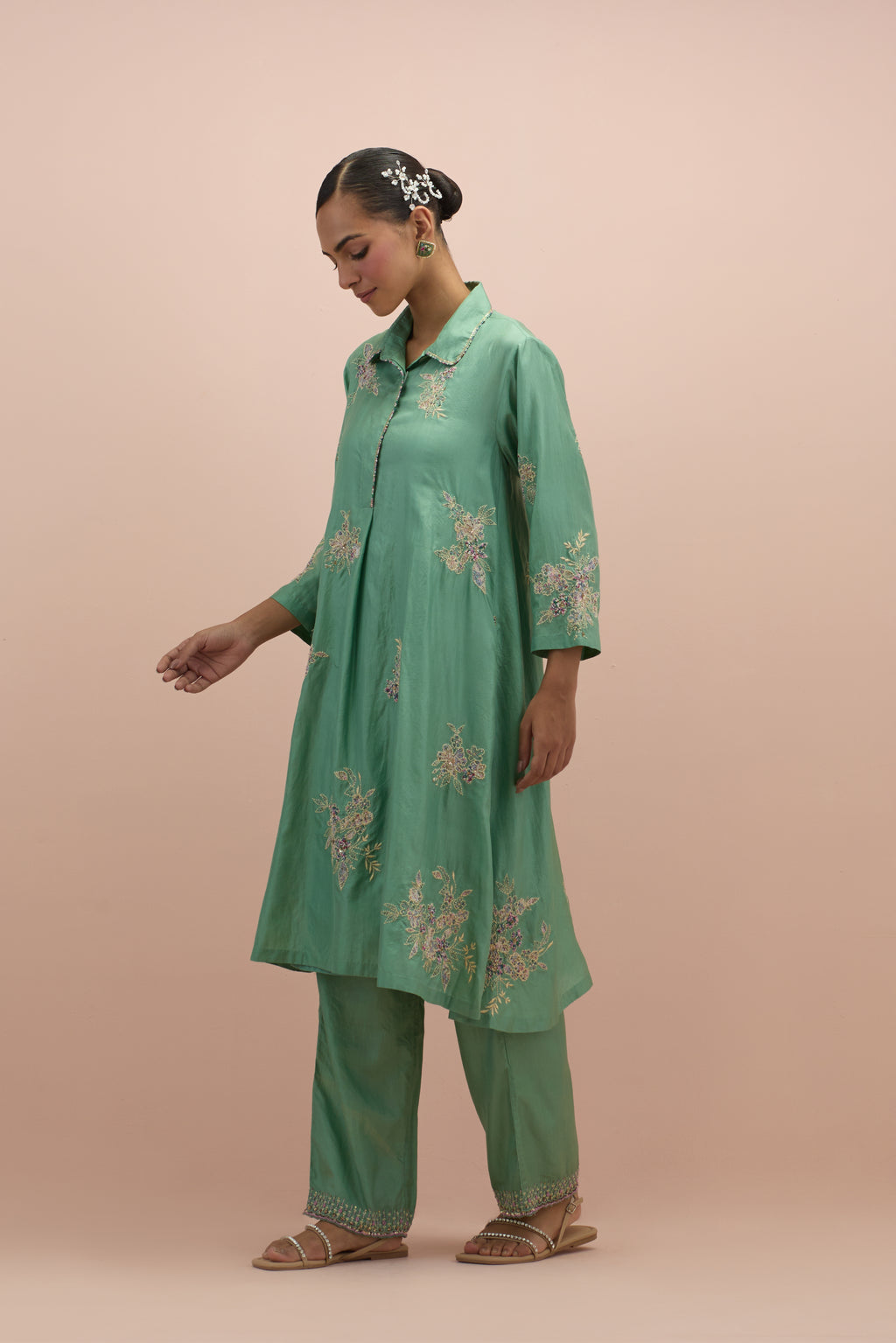 Jade green silk short shirt-kurta set with all-over appliqué flowers, highlighted with sequins and multi-colored beads.