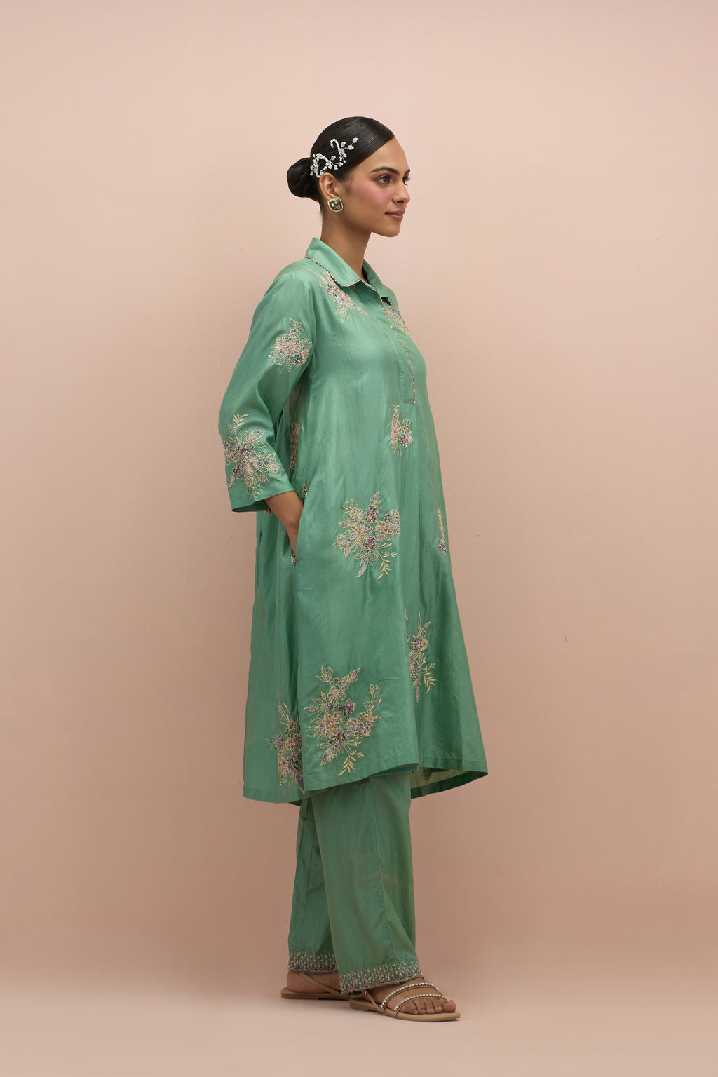 Jade green silk short shirt-kurta set with all-over appliqué flowers, highlighted with sequins and multi-colored beads.