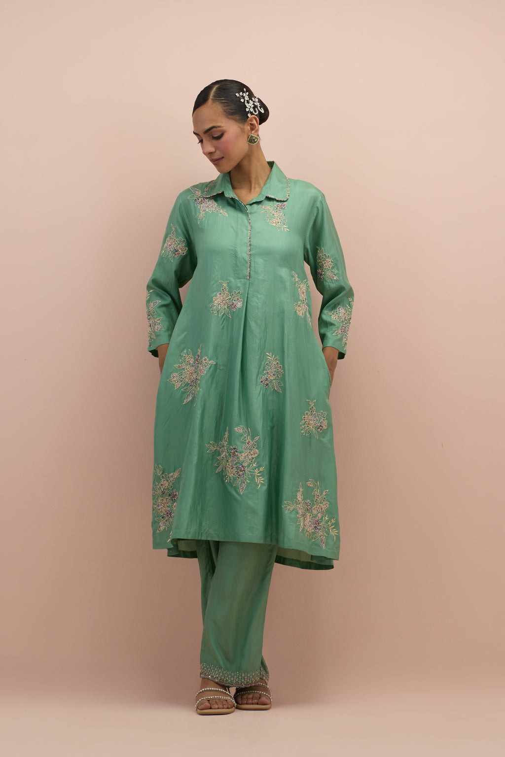 Jade green silk short shirt-kurta set with all-over appliqué flowers, highlighted with sequins and multi-colored beads.