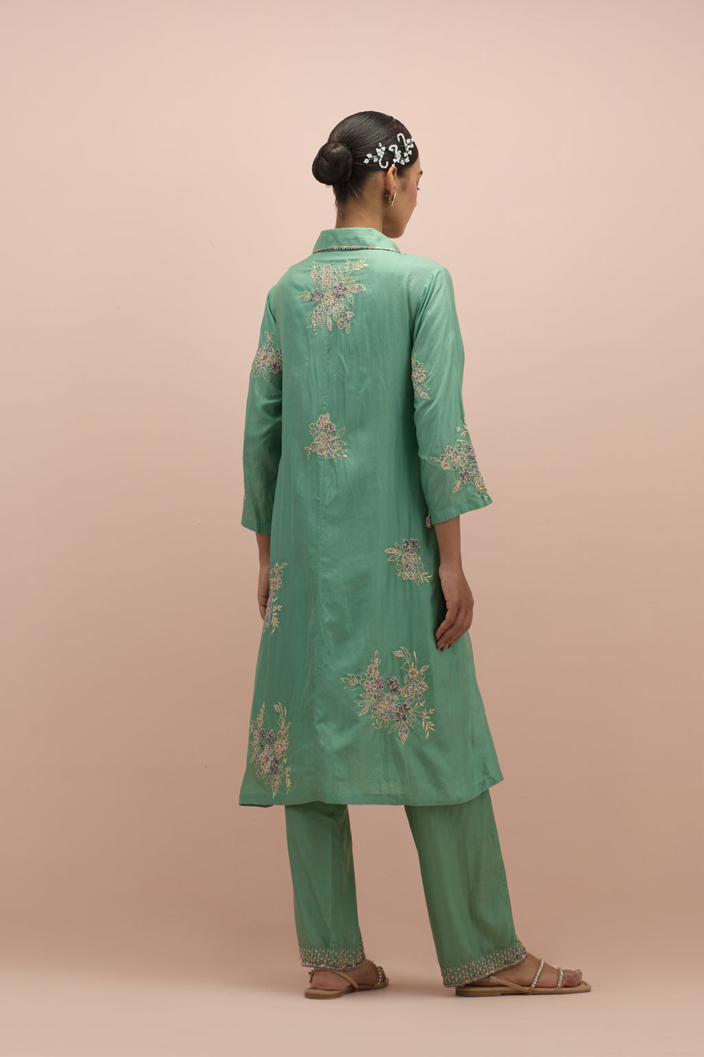 Jade green silk short shirt-kurta set with all-over appliqué flowers, highlighted with sequins and multi-colored beads.