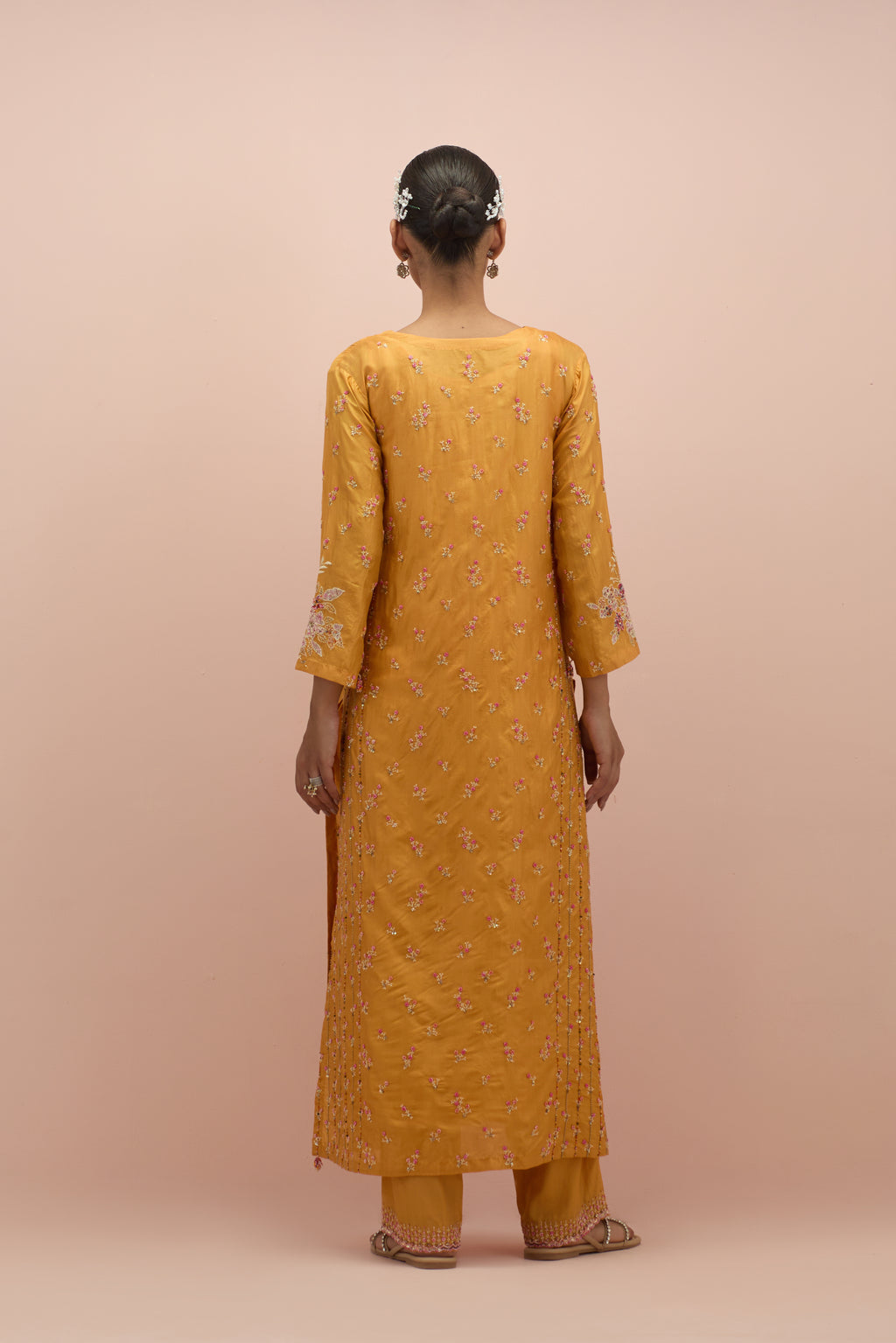 Amber straight kurta set with all-over delicate embroidered flowers, highlighted with sequins and multi-colored beads.