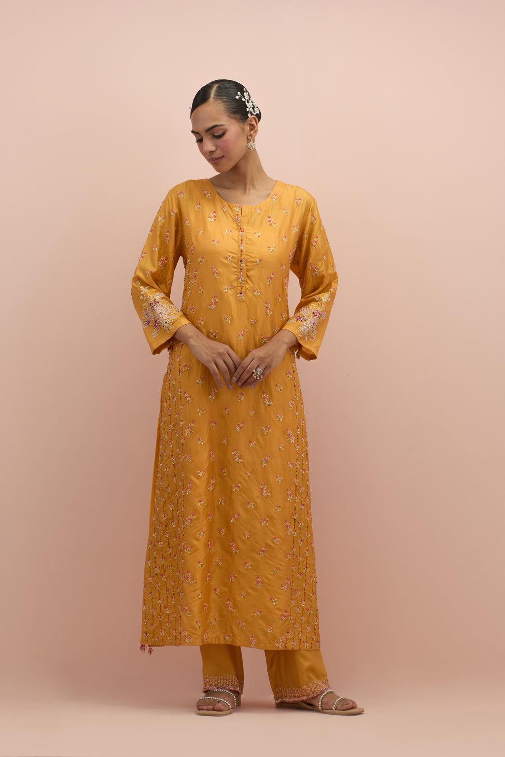 Amber straight kurta set with all-over delicate embroidered flowers, highlighted with sequins and multi-colored beads.