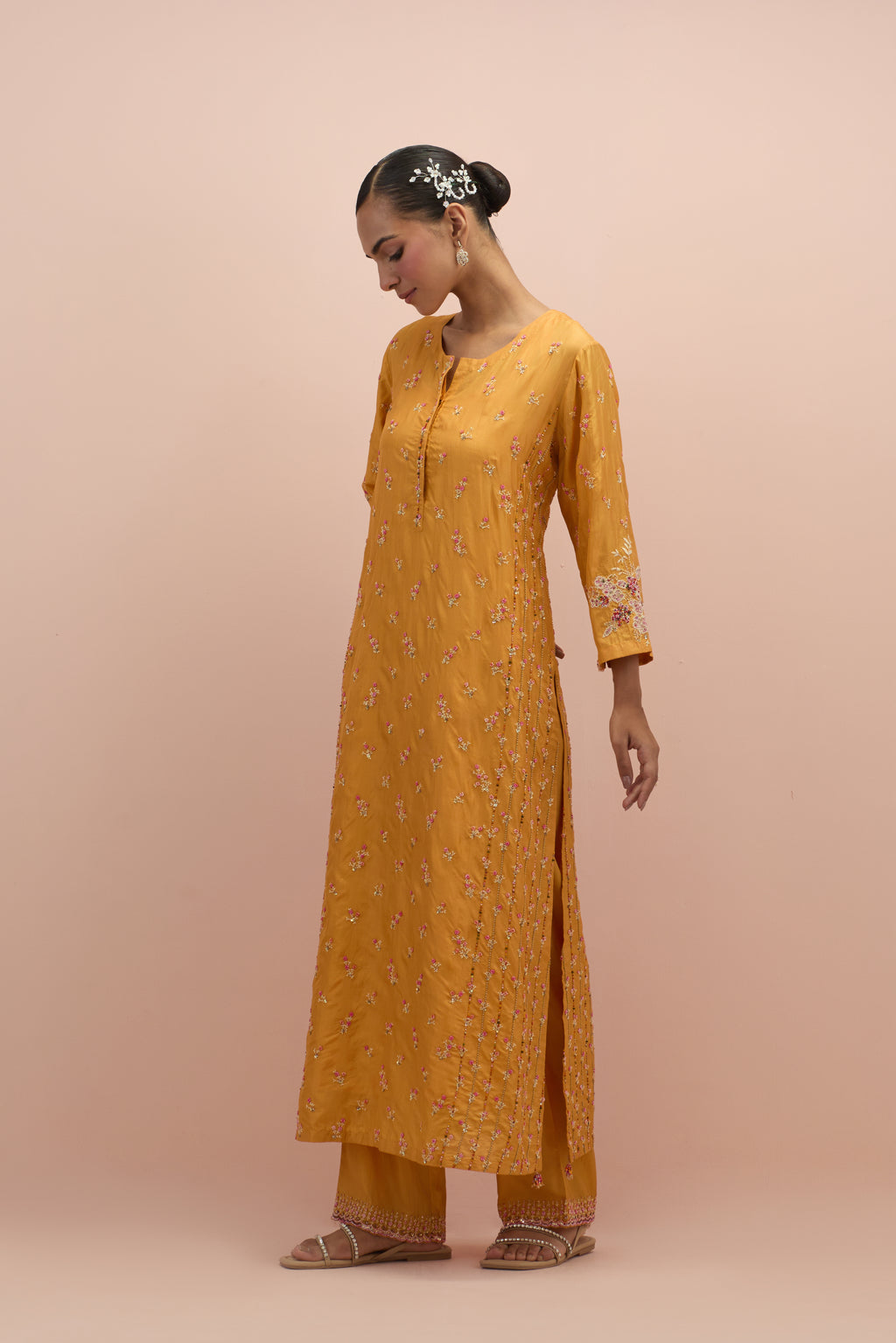 Amber straight kurta set with all-over delicate embroidered flowers, highlighted with sequins and multi-colored beads.