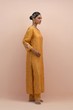 Amber straight kurta set with all-over delicate embroidered flowers, highlighted with sequins and multi-colored beads.