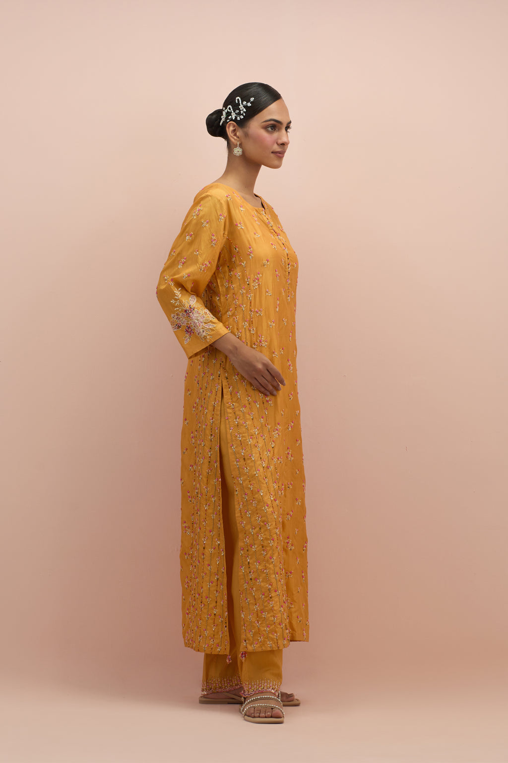 Amber straight kurta set with all-over delicate embroidered flowers, highlighted with sequins and multi-colored beads.