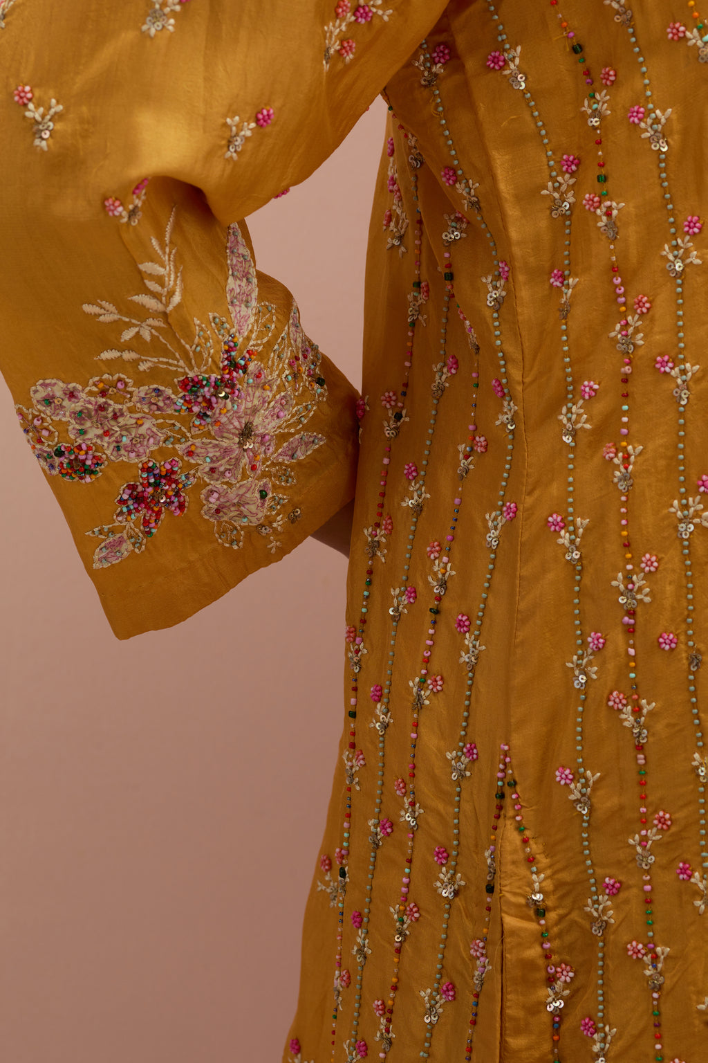 Amber straight kurta set with all-over delicate embroidered flowers, highlighted with sequins and multi-colored beads.