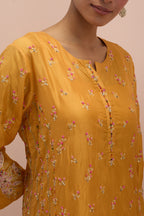 Amber straight kurta set with all-over delicate embroidered flowers, highlighted with sequins and multi-colored beads.