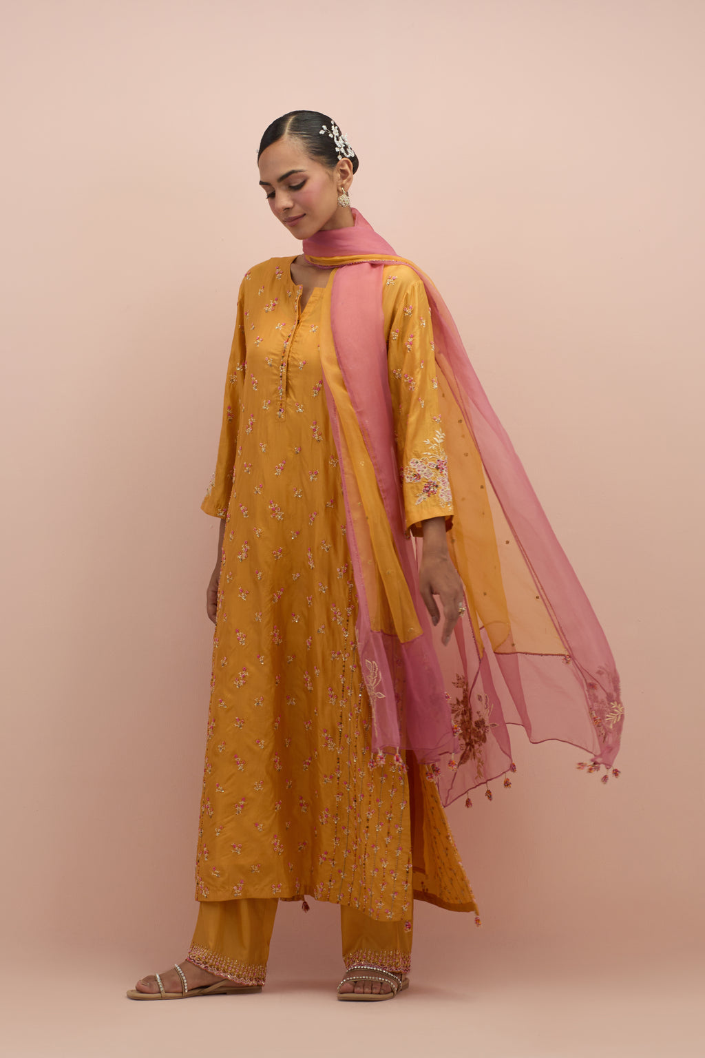 Amber straight kurta set with all-over delicate embroidered flowers, highlighted with sequins and multi-colored beads.