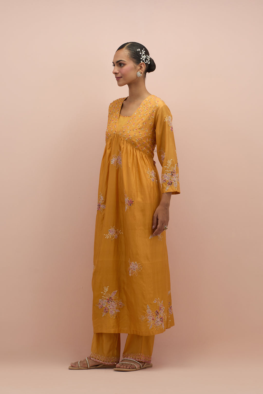 Amber silk kurta dress set with delicate embroidered flowers and hand block printed appliqué motifs, highlighted with sequins and multi-colored beads.