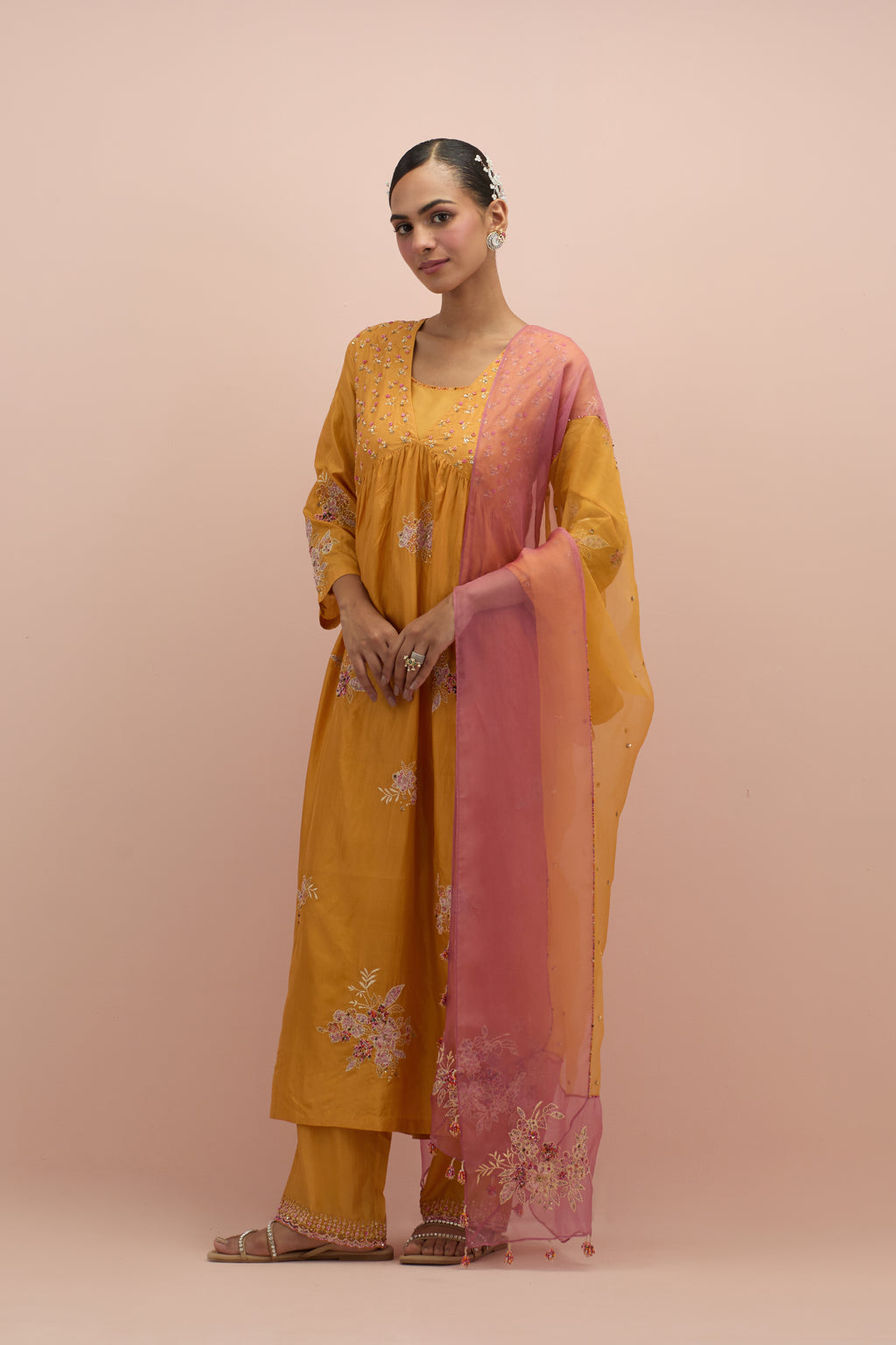 Amber & salmon pink silk organza narrow dupatta, highlighted with all-over delicate sequins flower and hand block printed appliqué motifs at dupatta corners.