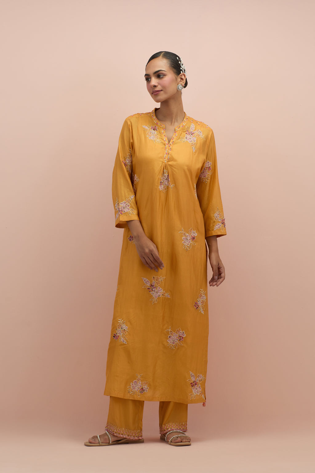 Amber straight kurta set with all-over delicate embroidered flowers, highlighted with sequins and multi-colored beads.