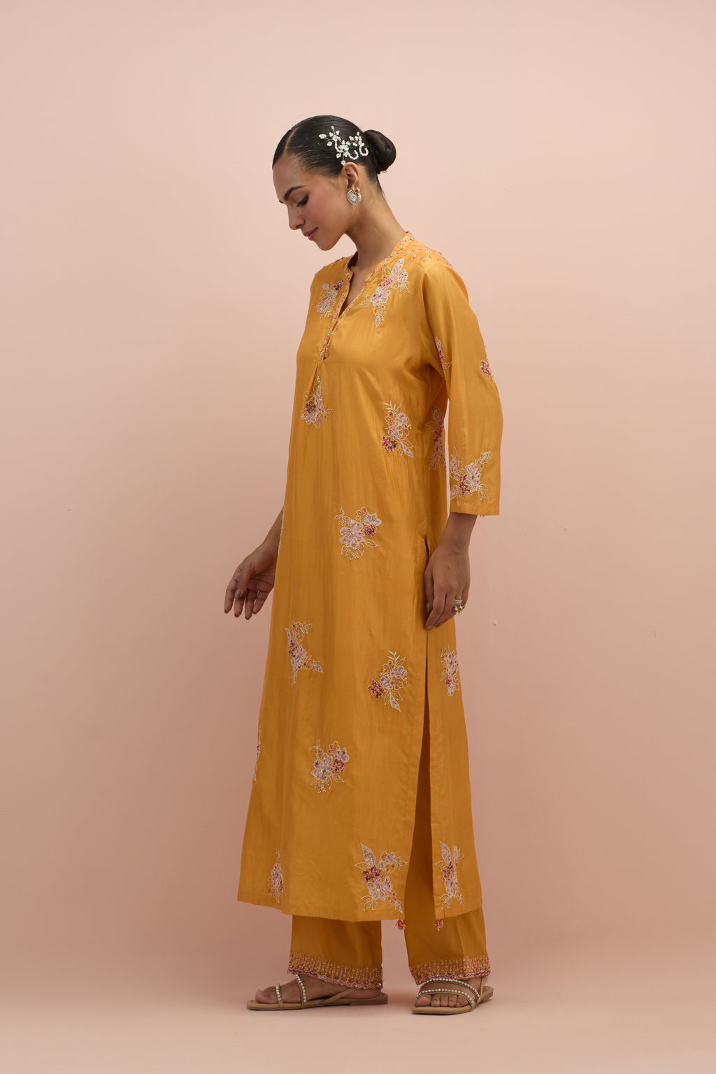 Amber straight kurta set with all-over delicate embroidered flowers, highlighted with sequins and multi-colored beads.