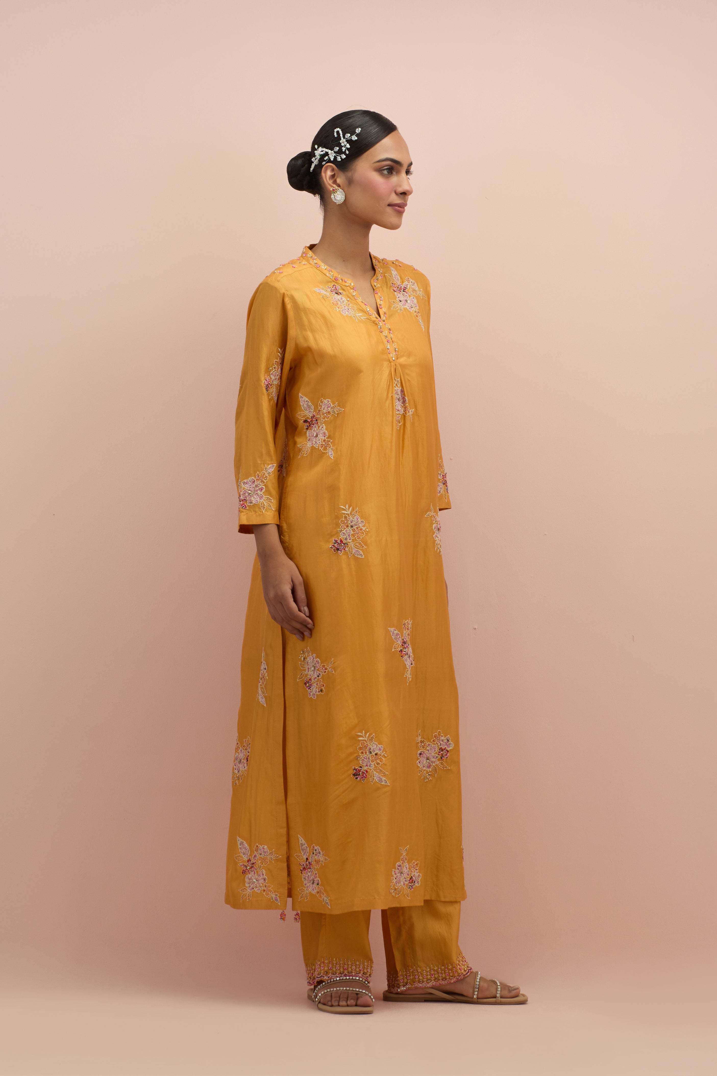 Amber straight kurta set with all-over delicate embroidered flowers, highlighted with sequins and multi-colored beads.