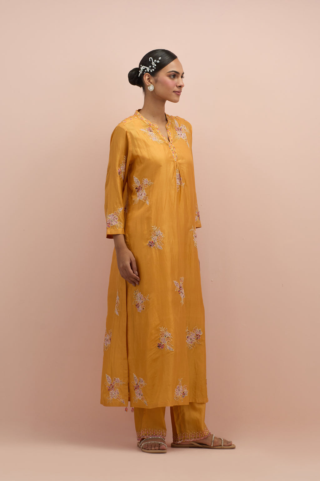 Amber straight kurta set with all-over delicate embroidered flowers, highlighted with sequins and multi-colored beads.