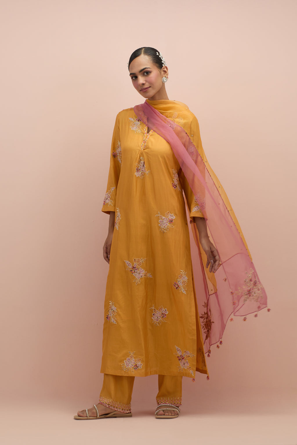 Amber straight kurta set with all-over delicate embroidered flowers, highlighted with sequins and multi-colored beads.